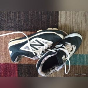 New Balance cleats, black and white in color, size 5y